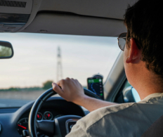 A man is driving a car