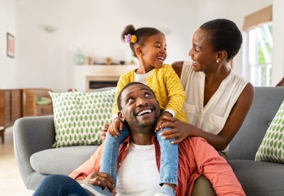 Happy black family enjoying at home